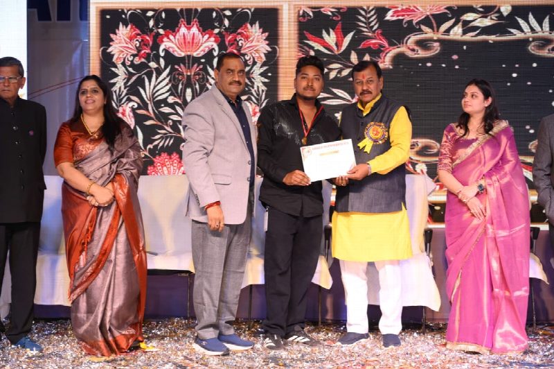 Receiving an industry excellence award on stage